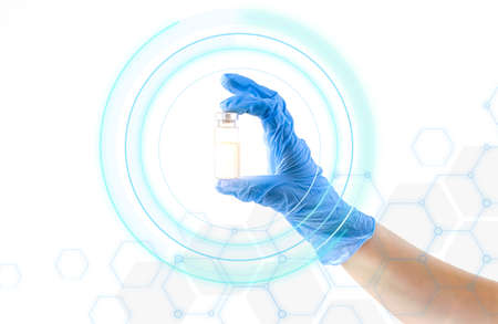 Doctor in gloves holds a bottle with a vaccine, medicine. Treatment and health concept.
