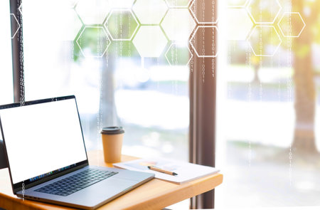 Business, technology, internet and networking concept. office work on laptop, security icon on virtual display, protection, computer network and technology security, infographics with polygonsの写真素材