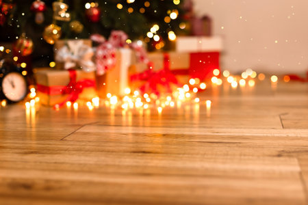 Blurry Christmas background with lights and space for a copy. Beautiful festive background with blurred lights, glare, glitter, magical radiance. The concept of Christmas. Background, screensaver, postcardの写真素材