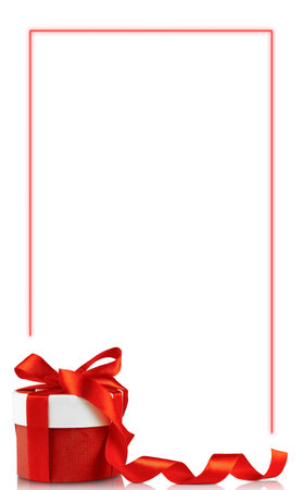 Christmas gift on white background with red neon frame. Festive image, vertical photo, red bow and red ribbonの写真素材