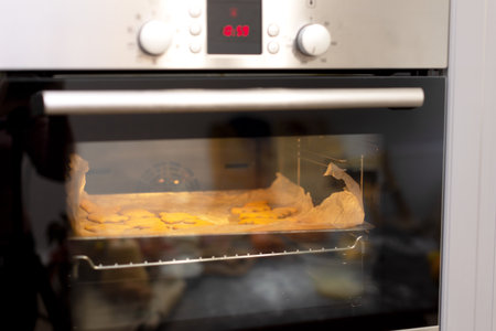 Cookies for Halloween and Thanksgiving are baked in the oven. Delicious curly cookies in the form of...