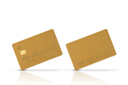 Two gold bank cards isolated on a white background with reflection and shadow. Credit cards blank for advertising with space for copy, debit gold cards for paying for goods, white backgroundの写真素材