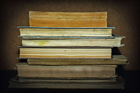 old books on wooden backgroundの写真素材