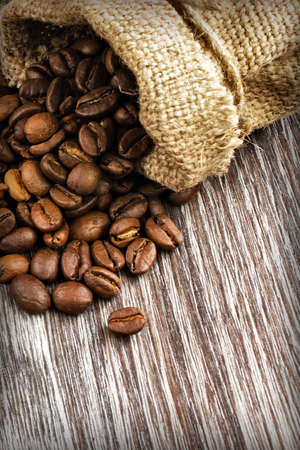 coffee beans in burlap sackの写真素材