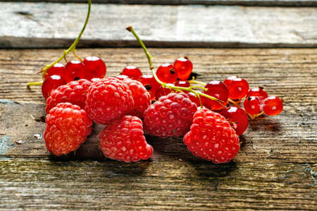 fresh raspberries on wooden backgroundの写真素材