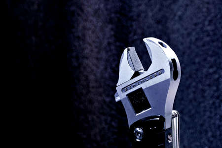 adjustable wrench on a dark backgroundの写真素材