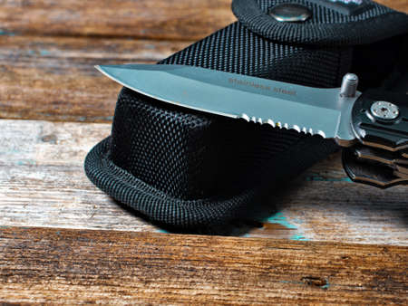 knife blade on wooden backgroundの写真素材