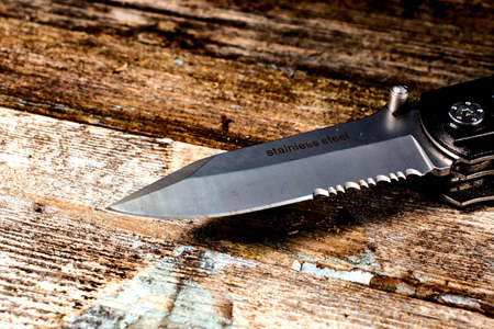 knife blade on wooden backgroundの写真素材