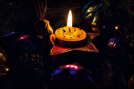 christmas decoration with candles and fir branchesの写真素材