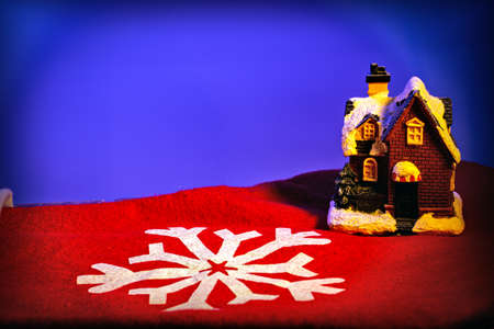 christmas gingerbread house on a red backgroundの写真素材