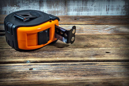 tape measure on wooden backgroundの写真素材