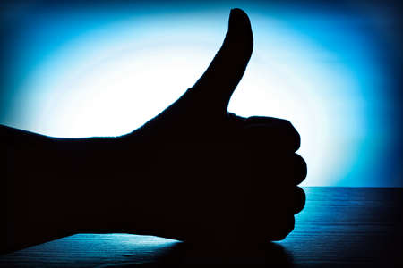hand with thumb upの写真素材