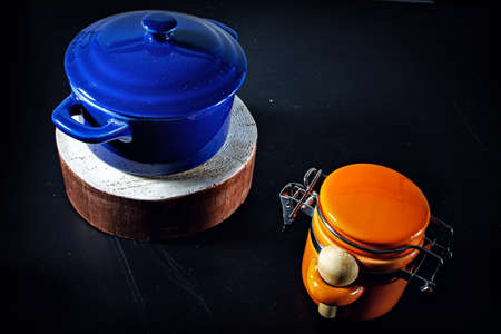 Blue pan and sugar bowl on a black backgroundの写真素材