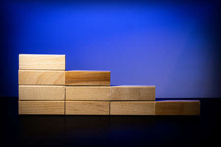 Wooden blocks in the form of steps. Ladder career path concept for business growth success process.の写真素材