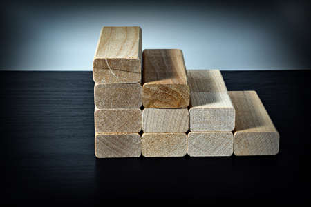 Wooden blocks in the form of steps. Ladder career path concept for business growth success process.の写真素材