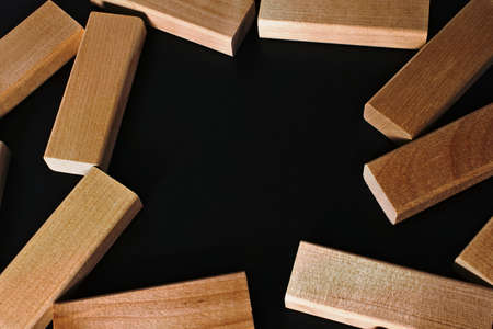 Frame of wooden blocks on a black backgroundの写真素材