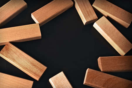 Frame of wooden blocks on a black backgroundの写真素材