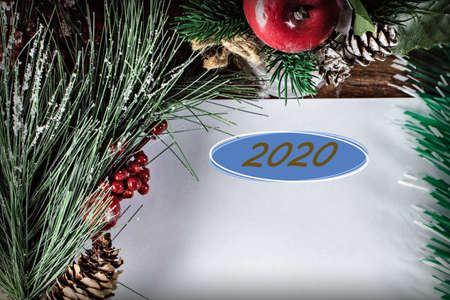 Christmas and New Year holiday background with spruce branches and red berries. Christmas card, top view. Place for text.の写真素材