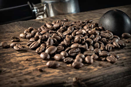 coffee beans and accessories on textured wooden backgroundの写真素材