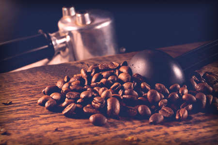 coffee beans and accessories on textured wooden backgroundの写真素材