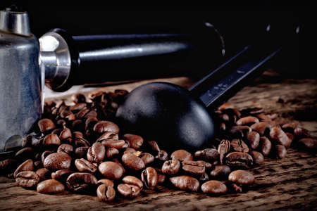 coffee beans and accessories on textured wooden backgroundの写真素材