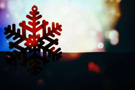 Christmas background with snowflake and twinkling lights.の写真素材