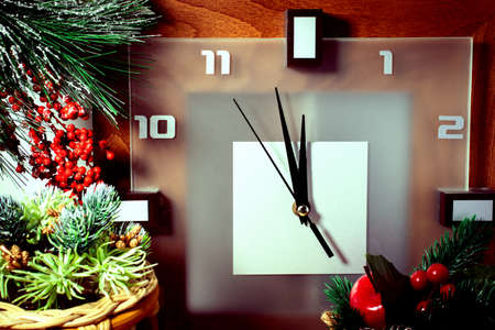 Background with Christmas decorations and a clock showing the time before the New Yearの写真素材