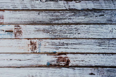 Background with wooden slats with traces of white paintの写真素材