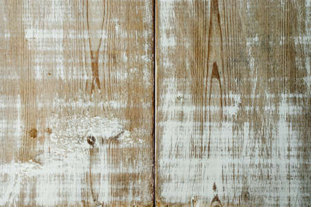 Background with wood with traces of old white paintの写真素材