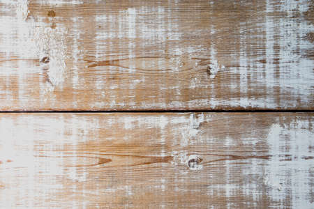 Background with wood with traces of old white paintの写真素材