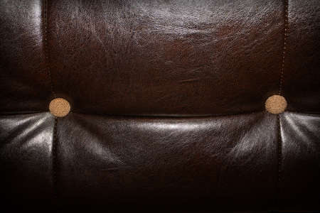 Background with brown leather upholstery texture.の写真素材