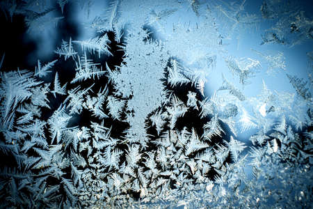 Background with winter frosty patterns on the windowの写真素材