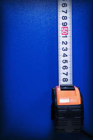 Background with tape measure on a blue backgroundの写真素材