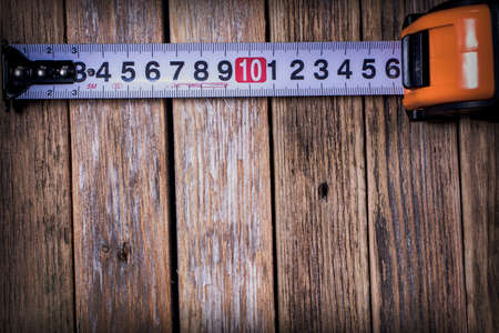 tape measure on wooden backgroundの写真素材