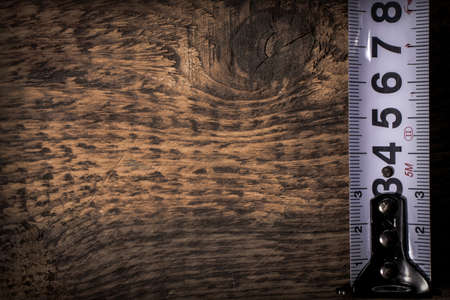 measuring tape on wooden backgroundの写真素材