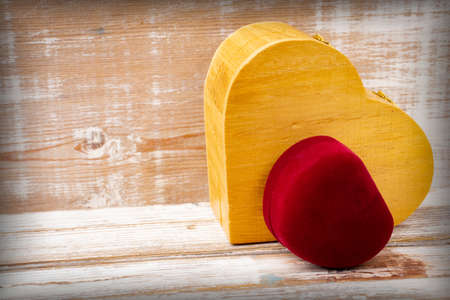 Gift red box and a wooden box in the shape of a heart. Valentine's Dayの写真素材