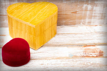 Gift red box and a wooden box in the shape of a heart. Valentine's Day