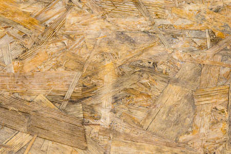 Background with texture of old chipboardの写真素材