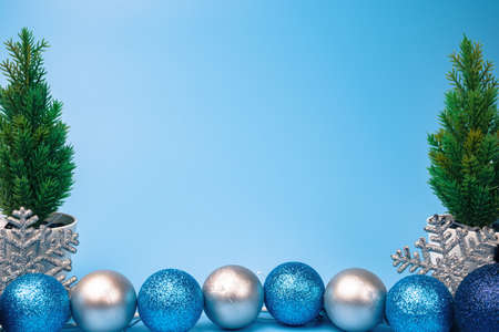 Christmas background with Christmas balls and green trees. New year concept. Copy spaceの写真素材