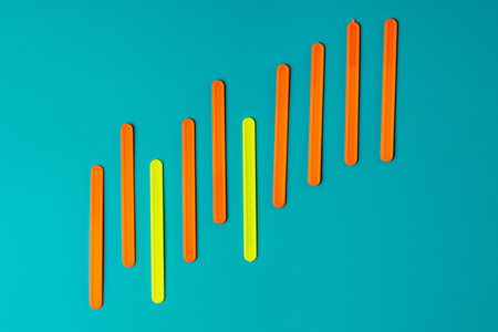 Colored sticks in the form of a graph of profit against the background of the color of sea water. Business growth concept, results of the yearの写真素材