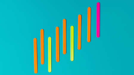 Colored sticks in the form of a graph of profit against the background of the color of sea water.の写真素材
