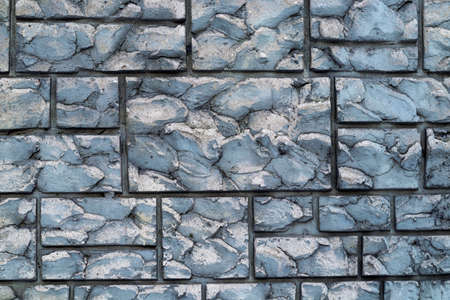 Background texture of an old wall under a natural gray stone in the form of brickwork. Decorative...