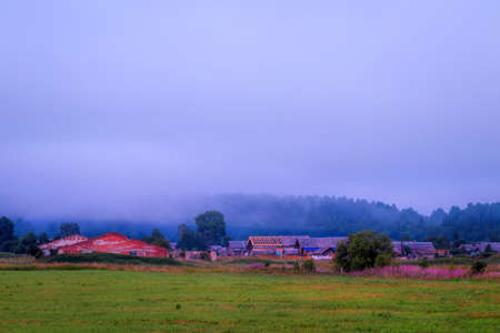 Beautiful evening view of the fog-covered village. Travel conceptの写真素材