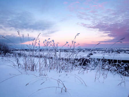 Sunrise over the snow-covered hillside. Winter landscapesの写真素材