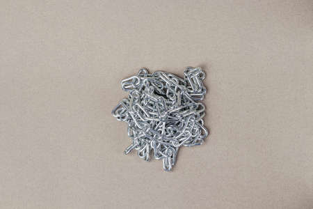 Pile of metal chains on a gray background. close-upの写真素材