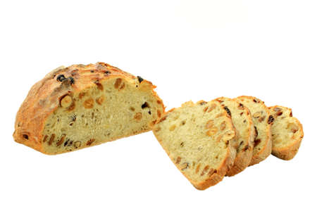 Stock Photo of Loaf cut on half and sliced Raisin, Honey, Hazelnut Specialty Bread isolated on white background   の写真素材