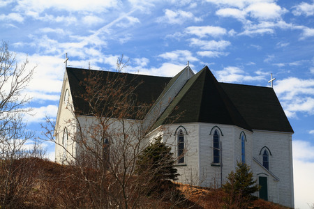 Old Anglican architectural Style Church first built in middle of 17th Century and modernized lately on  The Walk  road of Brigus Cove on the end of Conception  Brigus  Bay Newfoundland, Canada の写真素材