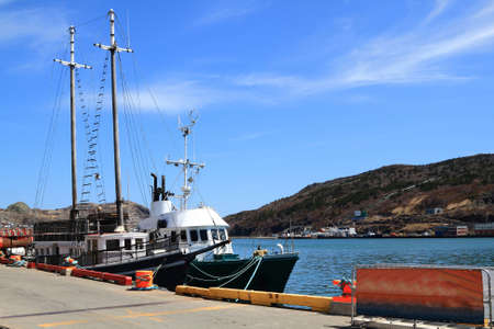 ST  JOHN S HARBOR - MARCH 17  St  John s Harbor, Newfoundland, Canada on March 17, 2014  Town of St  John s prepares for Celebration of Victoria Day Long Weekend and tourist boast wait for travelers のeditorial素材