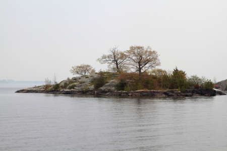 One of the Thousand Islands in Kingston Ontario St. Lawrence River area in Foggy Dayの写真素材