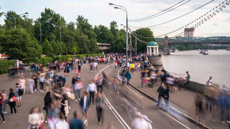 Walking among crowds of people along the parkway  on a warm summer's day.の写真素材